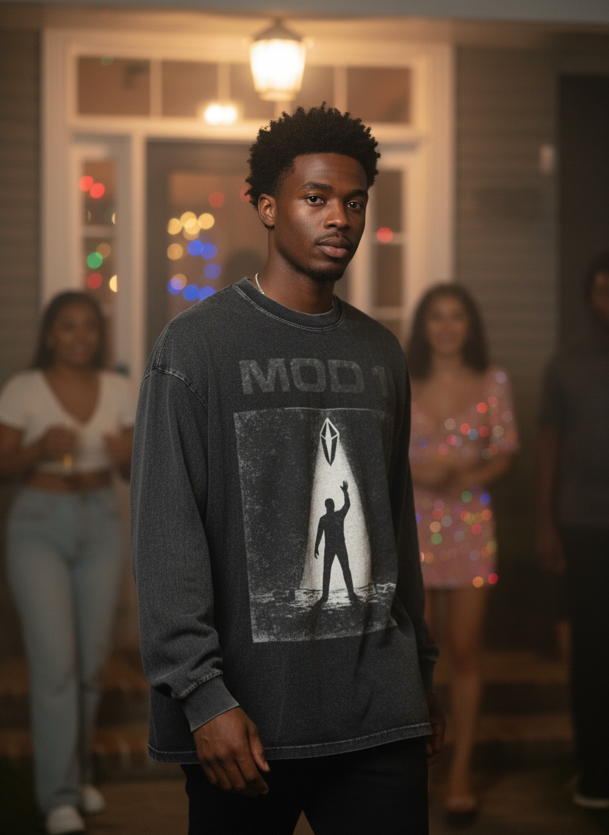 Man wearing a long-sleeve MOD 1 shirt with a graphic design in a social setting