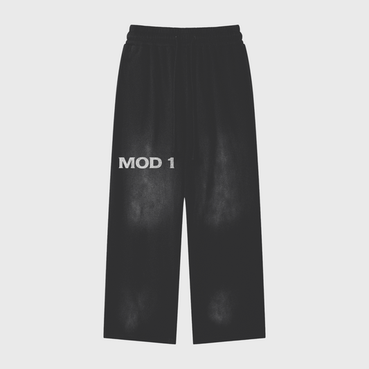 Black mode 1 wide leg pants with 'MOD 1' text on a light gray background