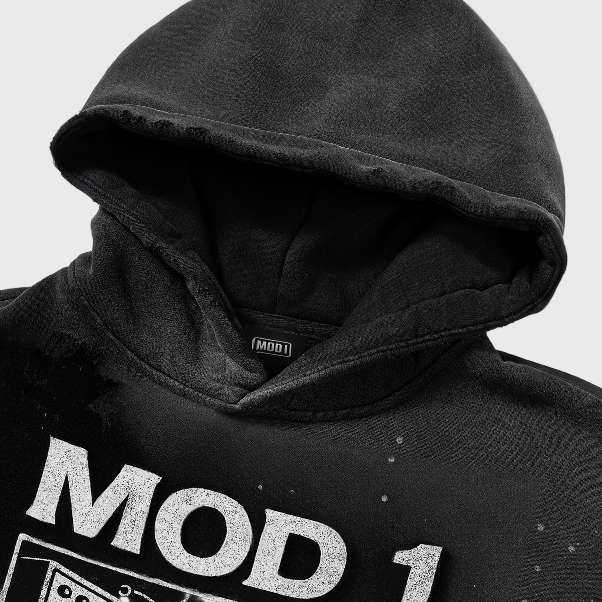 Black hoodie with 'MOD 1' branding on a white background