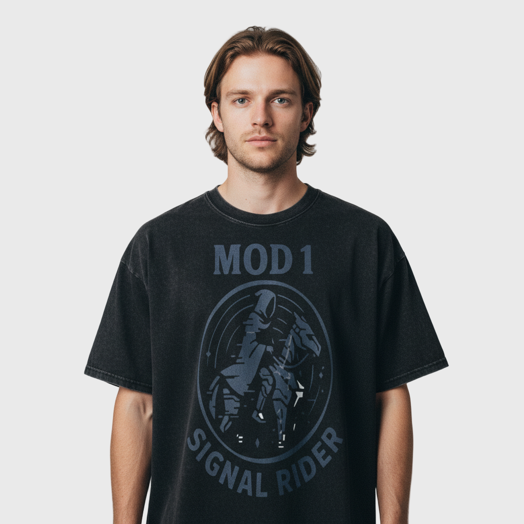 Man wearing a black t-shirt with 'MOD 1 SIGNAL RIDER' design on a plain background