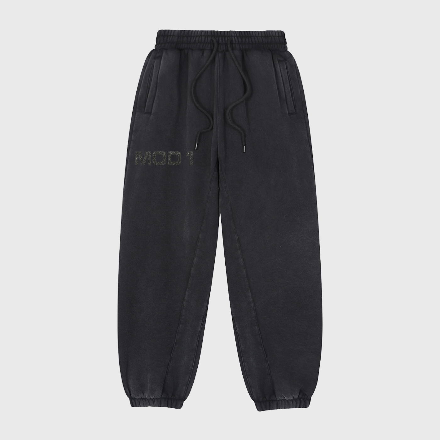 Black MOD 1 sweatpants with a brand logo on a light gray background