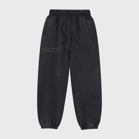 Black MOD 1 sweatpants with a brand logo on a light gray background